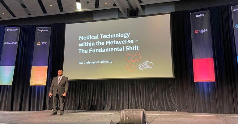 Christopher Lafayette on an IME West stage presenting Medical Technology within the Metaverse — The Fundamental Shift.