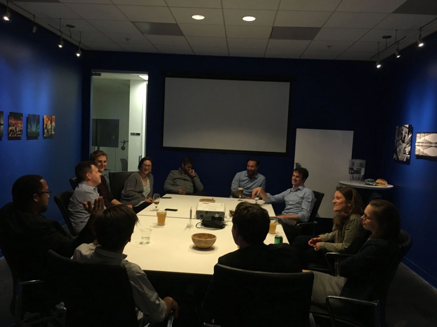 A group takes part in a roundtable discussion in a meeting room.