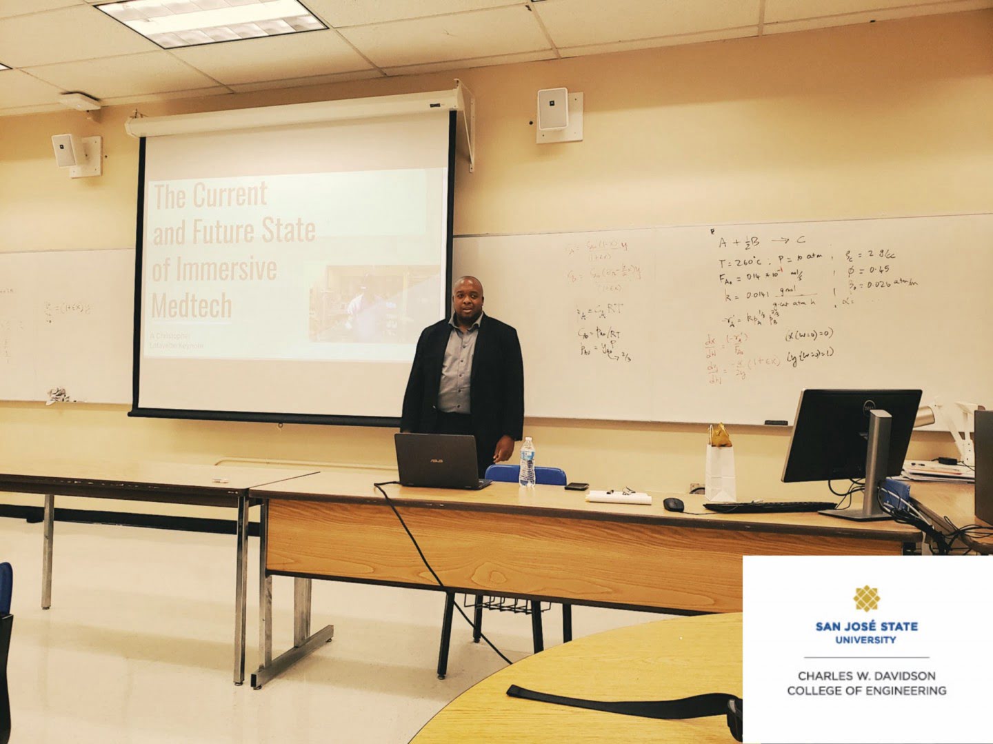 Christopher Lafayette lectures in a classroom at San Jose State University.